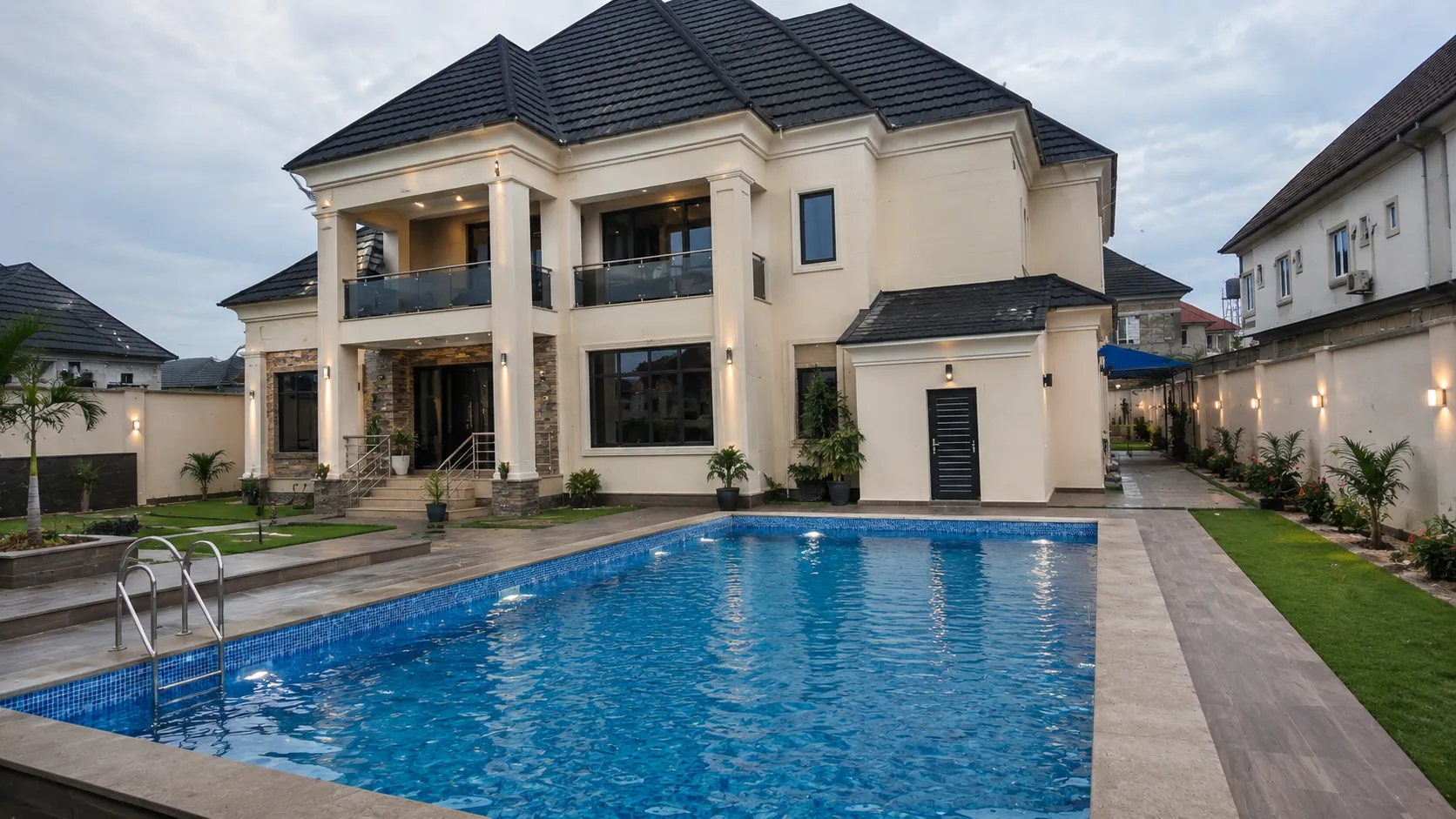 Completed residence with a prominent swimming pool and landscaped grounds
