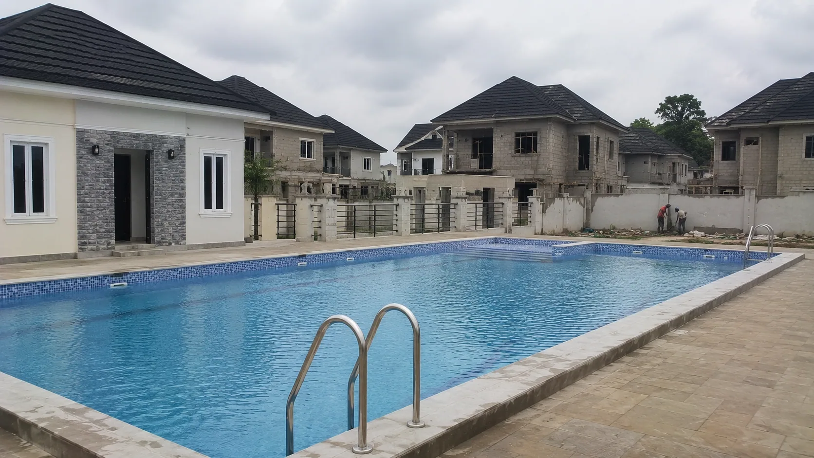 Large completed tiled swimming pool serving a residential development
